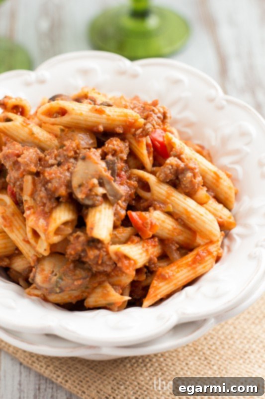 Sausage & Mushroom Ragu, an easy recipe featuring savory sausage and tender mushrooms.