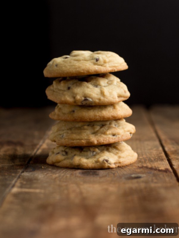 Perfectly baked soft and chewy chocolate chip cookies cooling on a rack.