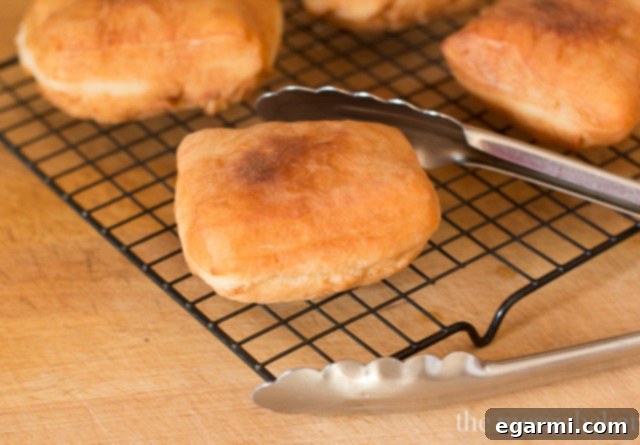 Buttermilk Beignet dough squares frying to golden perfection in hot oil