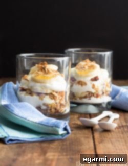 Hero shot for the Banana Bread Parfait recipe card, featuring a beautifully layered parfait with a spoon, inviting readers to try this healthy breakfast