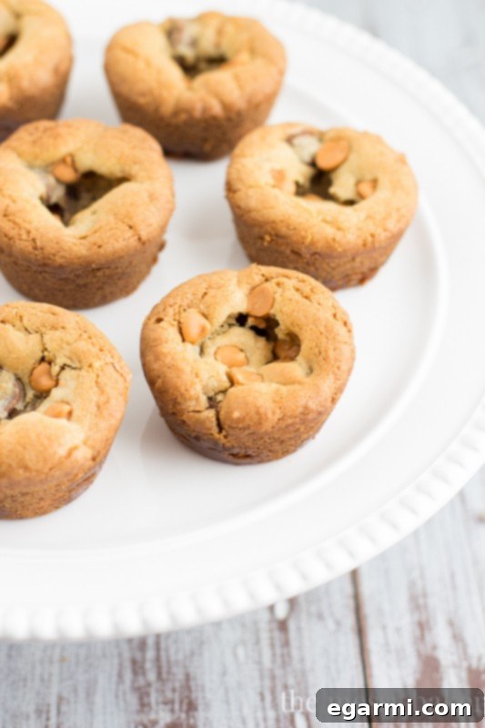 Side view of a Butterscotch Chocolate Caramel Cookie Cup, highlighting its soft, gooey interior