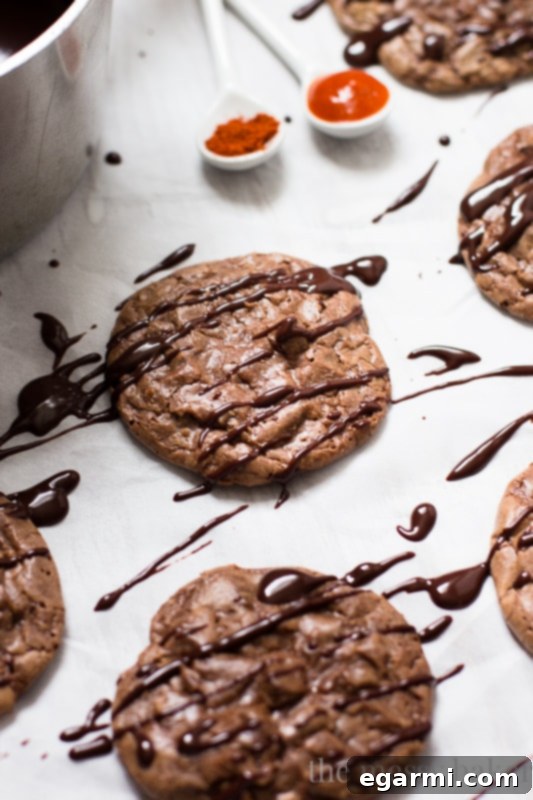 Close-up of a Double Chocolate Brownie Cookie with Sriracha Ganache, highlighting its rich texture and the glistening ganache drizzle.