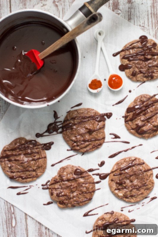Baked Double Chocolate Brownie Cookies cooling on a wire rack, illustrating the post-bake process before ganache application.