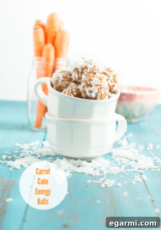 Delicious Carrot Cake Energy Balls on a wooden surface, showcasing their healthy and appealing nature.