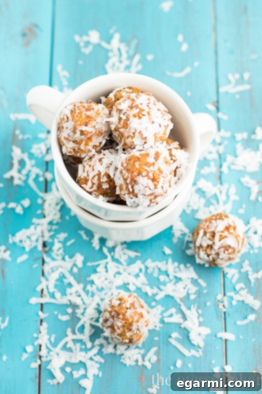 Close-up of Carrot Cake Energy Balls, highlighting their texture and the shredded coconut coating.