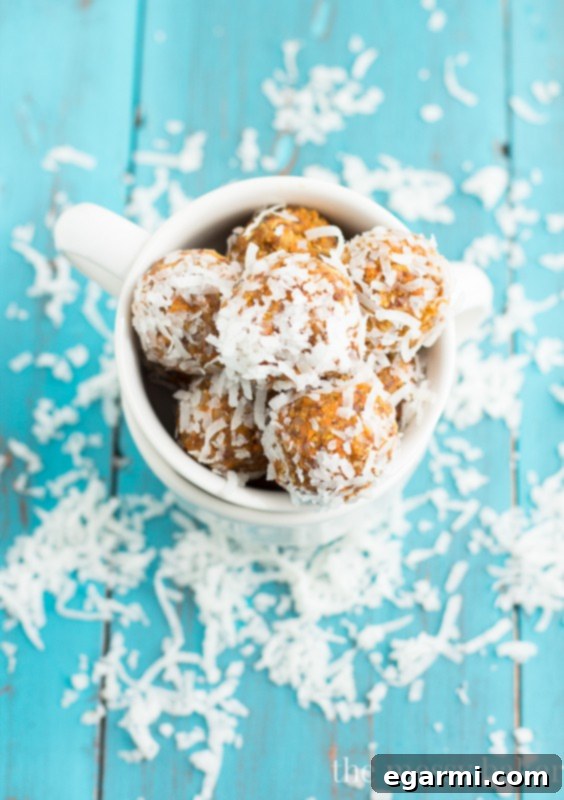 A close-up shot of Carrot Cake Energy Balls being prepared, showcasing the ingredients and the rolling process.