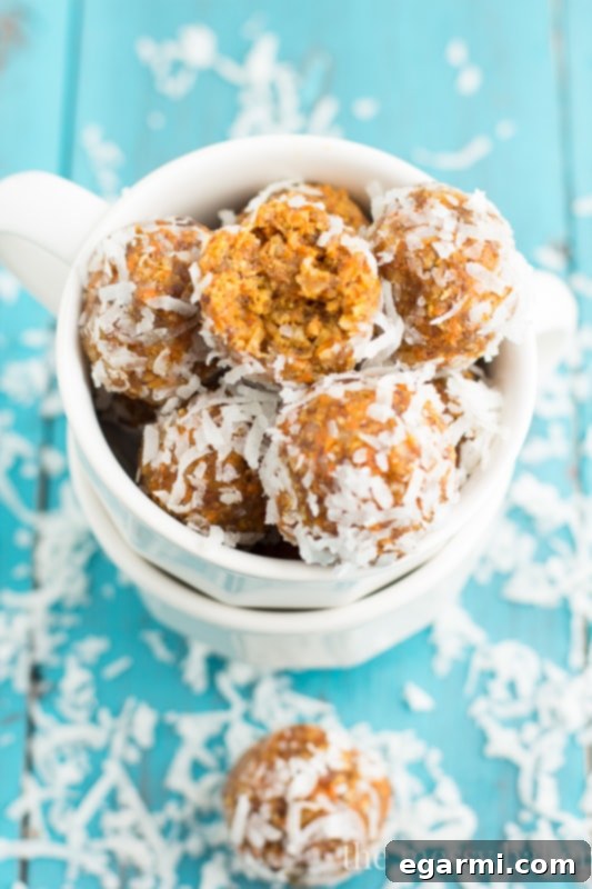 Seven Carrot Cake Energy Balls stacked elegantly, ready for a healthy indulgence.