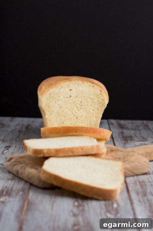 Freshly Baked White Bread Slices on Cutting Board | Perfect for Sandwiches