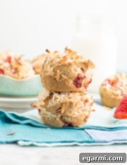 Gluten-Free Tropical Strawberry Coconut Muffins 7 Close-up of a baked Gluten-Free Strawberry Coconut Muffin showing texture and coconut topping