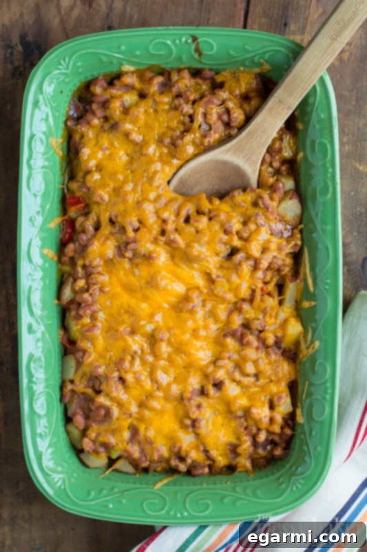 Hearty Loaded Potato and Baked Bean Bake 3 Close-up of the Loaded Baked Potato & Baked Bean Casserole showcasing its layered ingredients of potatoes, beans, and melted cheese