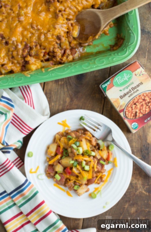 Hearty Loaded Potato and Baked Bean Bake 8 Serving suggestion for the Loaded Baked Potato & Baked Bean Casserole, garnished with fresh scallions for a pop of color