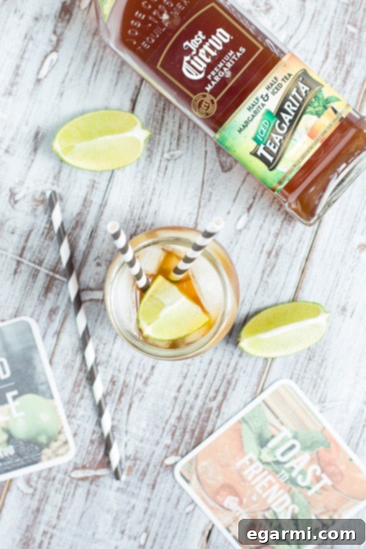 Refreshing Jose Cuervo Teagarita poured over ice with a fresh lime wedge garnish.