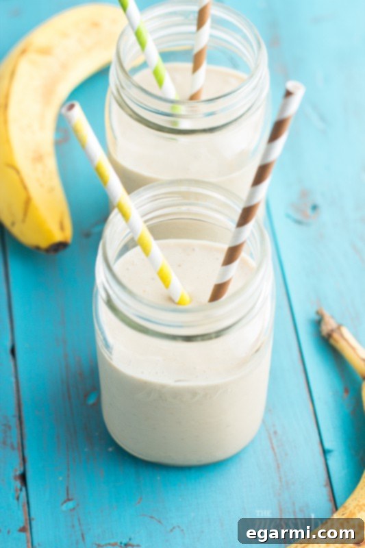 Energizing Peanut Butter Banana Oat Smoothie 6 Ingredients for Peanut Butter Banana Oat Smoothie laid out, including bananas, peanut butter, and oats.