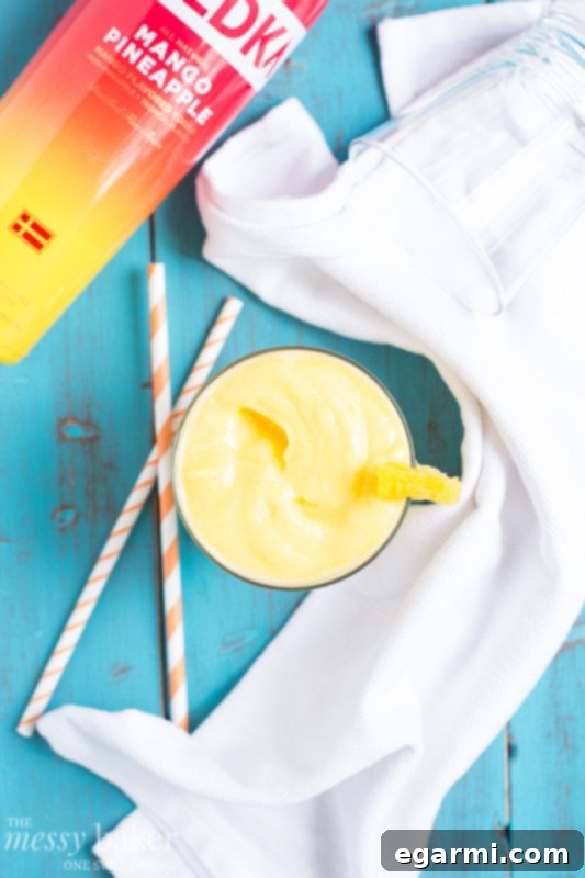 Close-up of a Frosty Glass of Pineapple Mango Slush on a Sunny Day