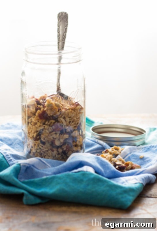 Ingredients for Cranberry Orange Granola mixed in a bowl