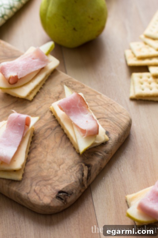 Smoked Ham, Havarti, and Pear Cracker Bites 7 Beautifully Arranged Havarti, Pear, & Smoked Ham Appetizer Bites Ready to Serve