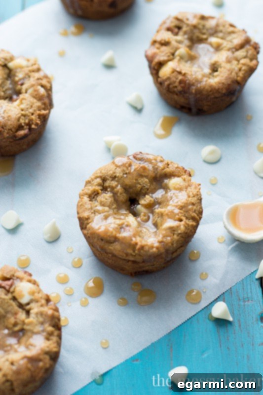 Pumpkin Cookie Cups Cooling Freshly baked Gluten-Free White Chocolate Pumpkin Cookie Cups cooling on a rack