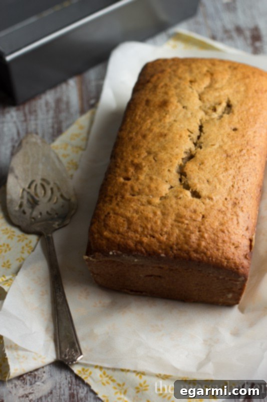 Showing the layering of Nutella and pecans over the banana bread batter.