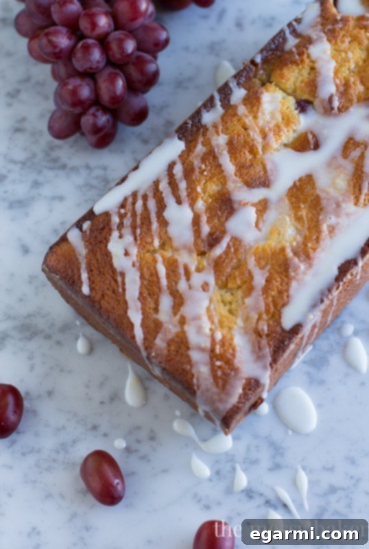 Serving Slices of Ricotta Pound Cake with Grapes and Lemon Glaze