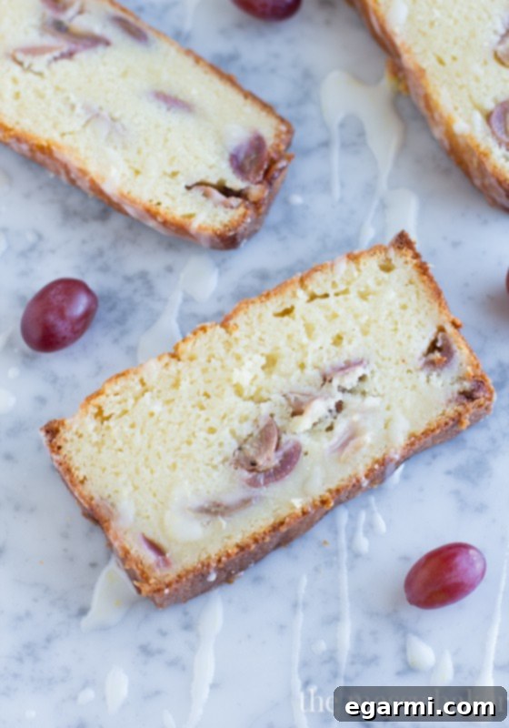 Beautiful Presentation of Ricotta Pound Cake with Grapes and Glaze