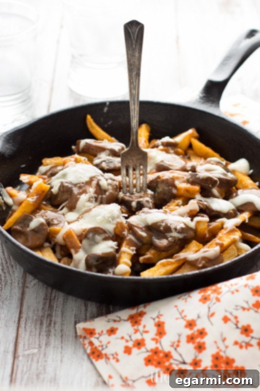 Hearty Gluten-Free Mushroom Swiss Poutine for family and friends.