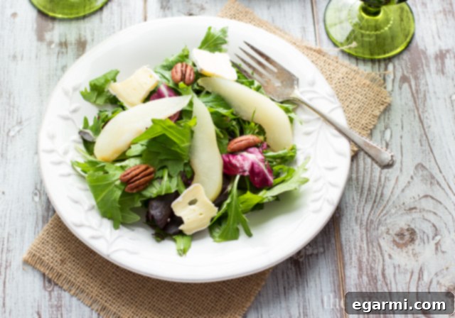 Poached Pear and Brie Salad with Balsamic Vinaigrette, showcasing the beautiful arrangement of ingredients.