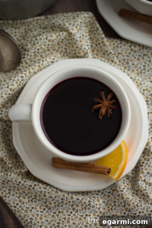 Cozy Pomegranate Mulled Wine for Sunday Supper 4 Pomegranate Mulled Wine | Garnished with orange slices and star anise