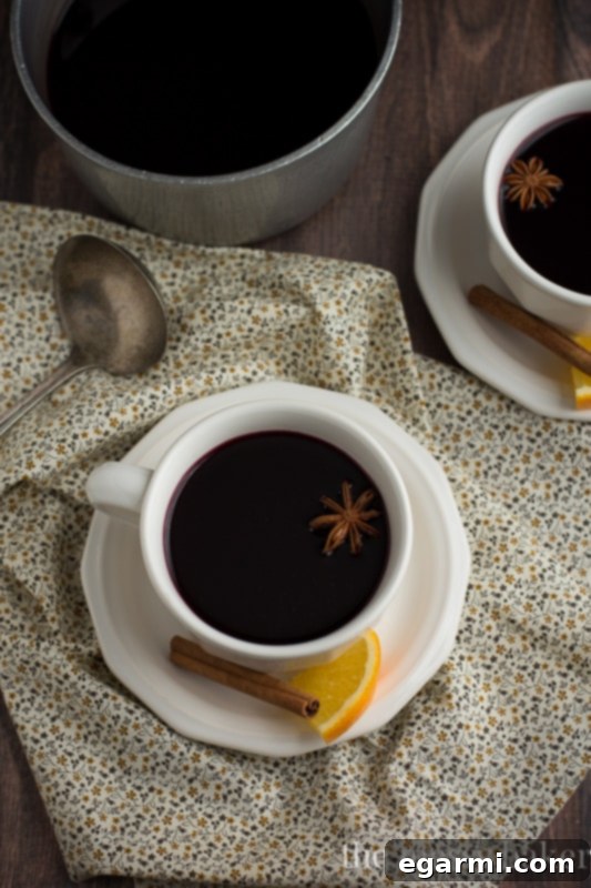 Cozy Pomegranate Mulled Wine for Sunday Supper 8 Pomegranate Mulled Wine | A festive drink ready for serving in a cozy setting