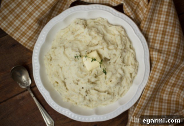 Three essential tools for making mashed potatoes: a potato masher, an electric mixer, and a food mill