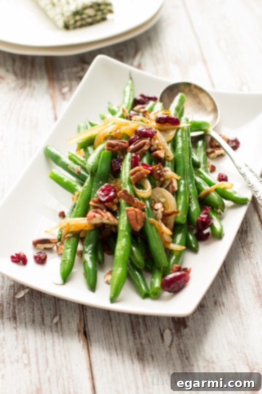 Freshly blanched green beans ready to be combined with savory caramelized onions, a cornerstone of this easy Thanksgiving side.
