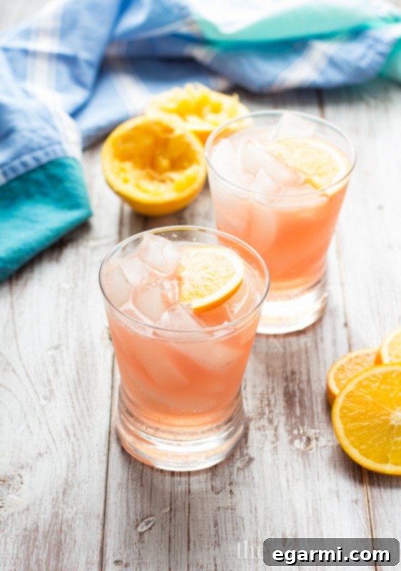 Cranberry Orange Crush Cocktail - A refreshing blend of tart cranberry, fresh orange juice, and vodka, perfect for holidays.