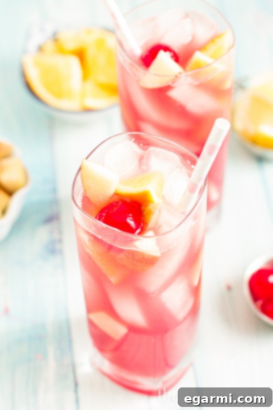 Black Cherry Sangria in a pitcher with fresh fruit