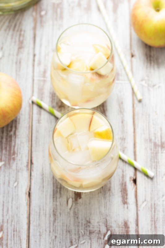 Sparkling Caramel Apple Sangria in a glass, ready to be enjoyed
