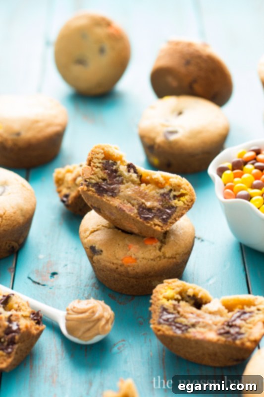Multiple Peanut Butter Stuffed Chocolate Chip Cookie Cups arranged artfully, showcasing their deliciousness