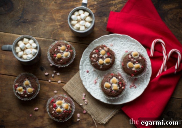 Close-up shot of Hot Chocolate Peppermint Muffins, showing melted marshmallows