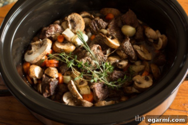 Preparing ingredients for a savory slow cooker steak and mushroom pie.