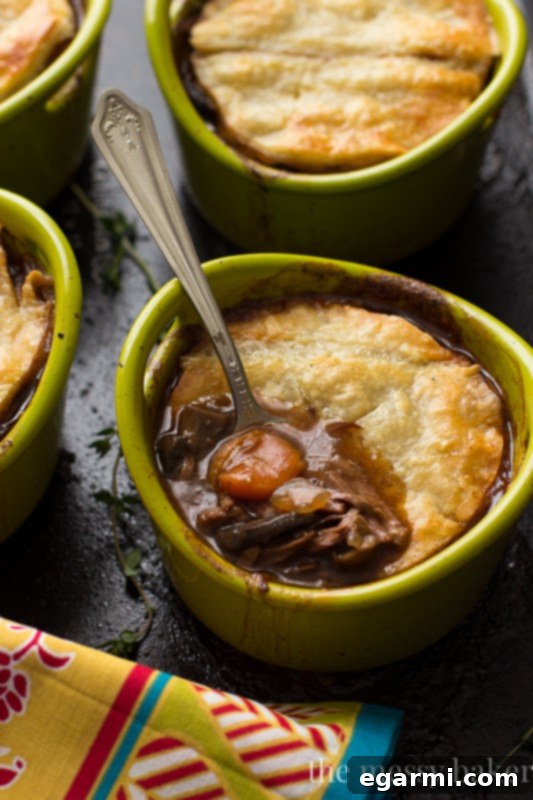 Flaky puff pastry topping a rich steak and mushroom pie filling.