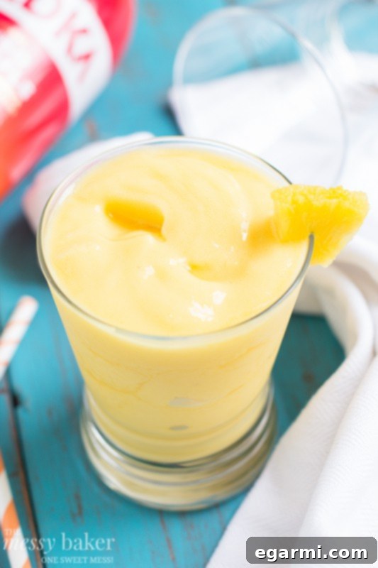 Pineapple Mango Slush Pineapple Mango Slush Cocktail, a refreshing and tropical drink for parties.