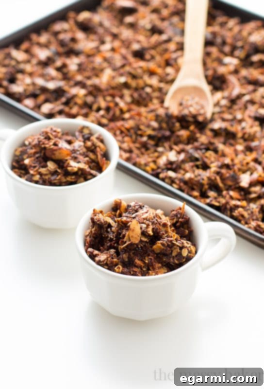 Mixing oats with melted Nutella for crunchy granola