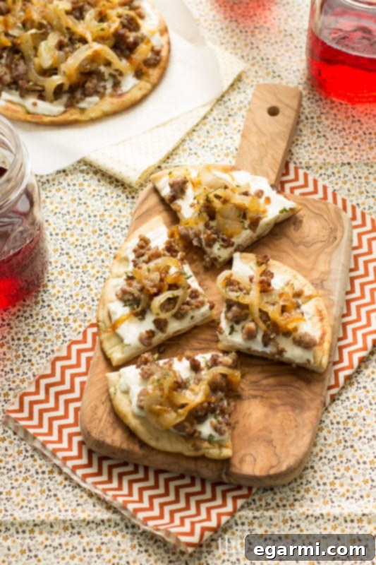 Sausage & Caramelized Onion Pita Pizza - Delicious Game Day Appetizer