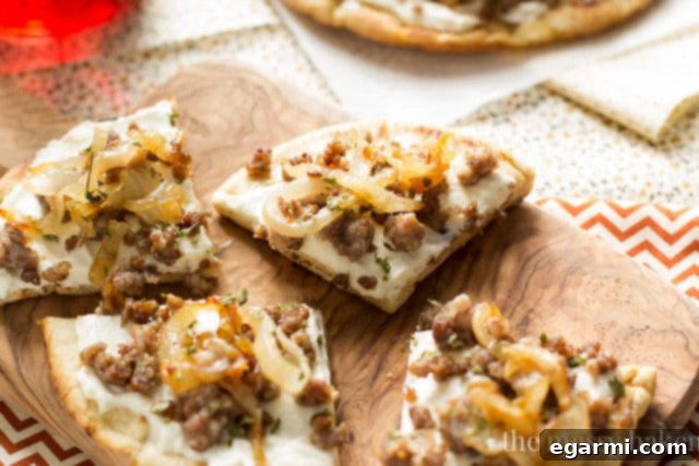 Grilling pita bread for Sausage & Caramelized Onion Pita Pizza