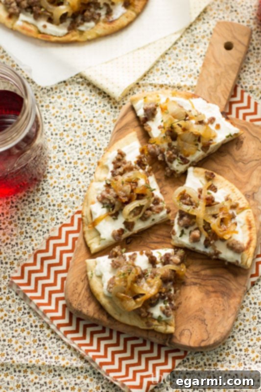 Finished Sausage & Caramelized Onion Pita Pizza with fresh thyme