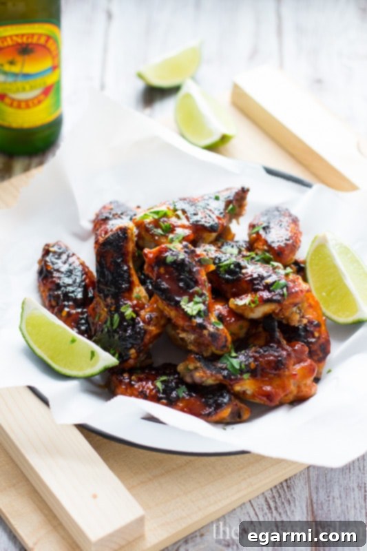 Perfectly crispy oven-baked sriracha wings on a platter, ready for serving