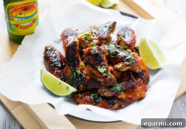 A plate of freshly glazed sriracha wings, perfectly charred and ready to be devoured