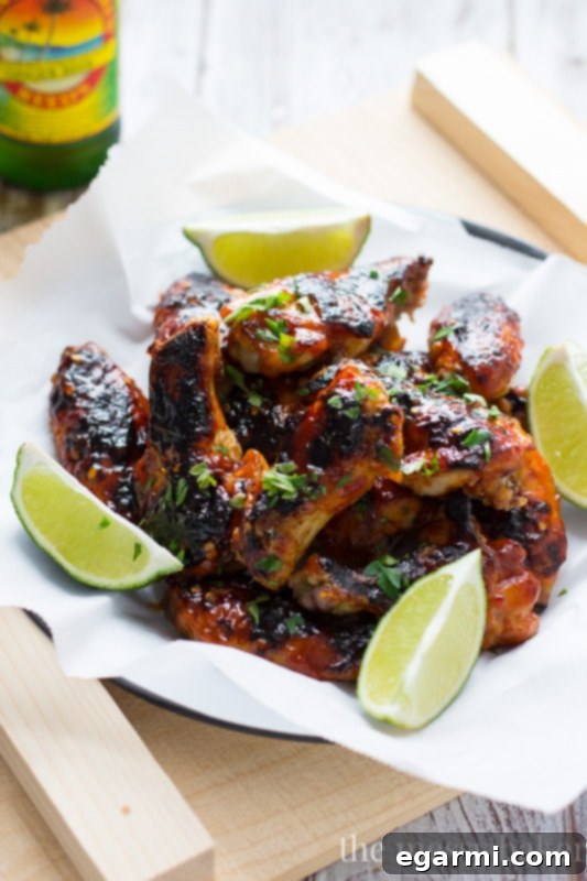 Appetizing bowl of sweet and spicy sriracha glazed chicken wings, perfect for sharing