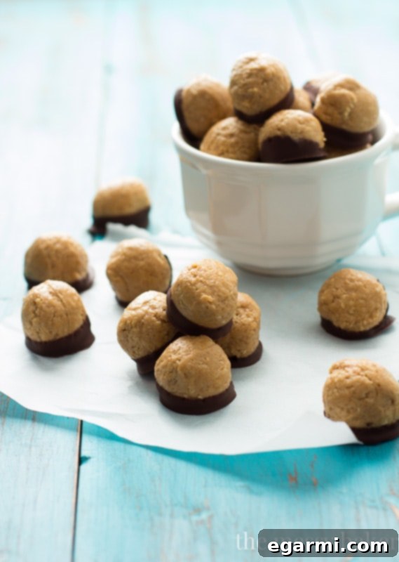 Delicious healthy peanut butter buckeyes dipped in dark chocolate, a perfect guilt-free treat