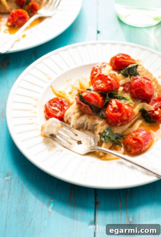Serving Pan-Seared Mahi Mahi with Roasted Tomatoes and Fennel over rice