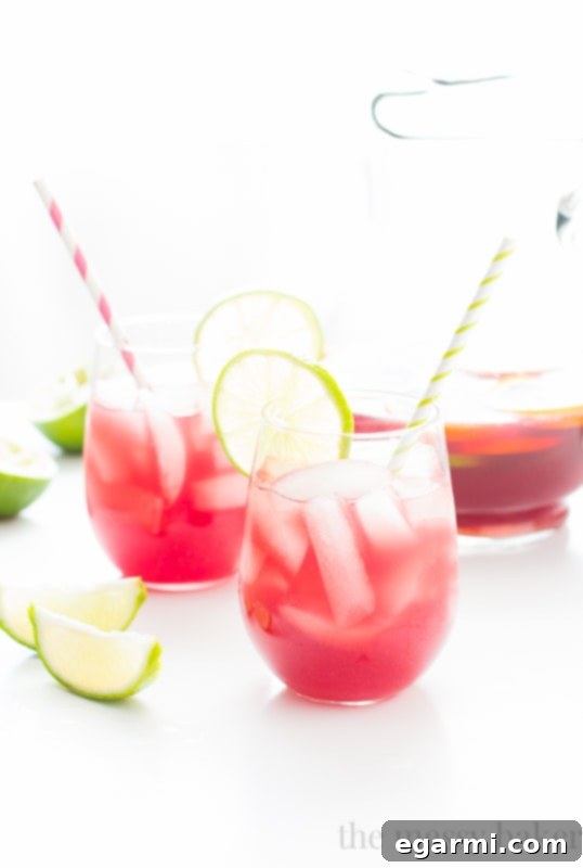 Several glasses of Sangrita cocktail lined up, ready for a party or social gathering.