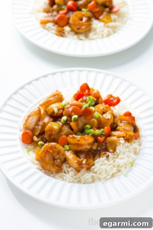 Close-up of fresh ingredients for garlic shrimp stir fry on a wooden cutting board