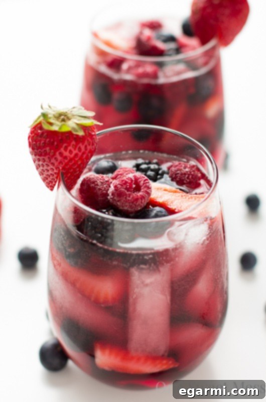 Vibrant Summer Berry Moscato Sangria with fresh berries